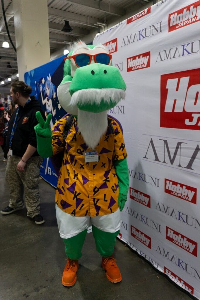 Photograph of a cosplayer dressed as Master Yoshi: A Yoshi dressed as Master Roshi from Dragon Ball