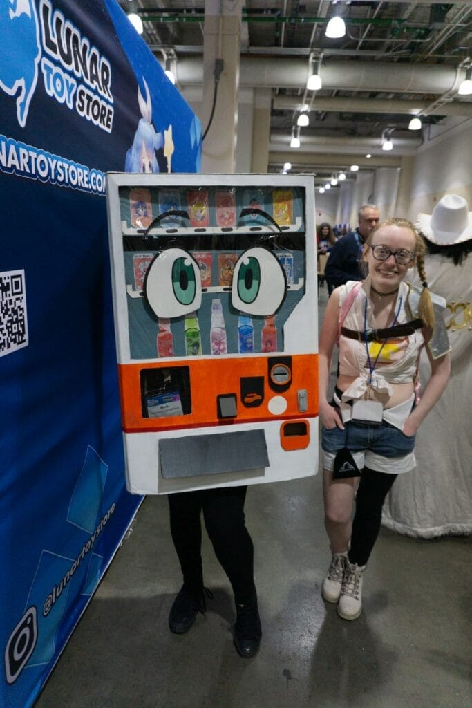 Cosplayers dressed as Boxxo and Lammis from Reborn as a Vending Machine, I Now Wander the Dungeon