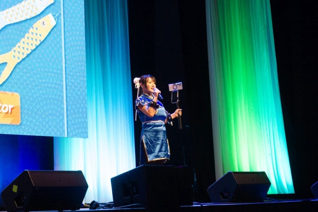 Content Creator Kaho Shibuya stands onstage at Anime Boston 2024's opening ceremonies