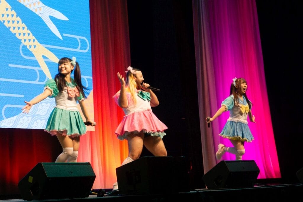 Babybeard - an idol group consisting of Ladybeard, Mahri, and Suzu, performing at Anime Boston 2024's Opening Ceremonies