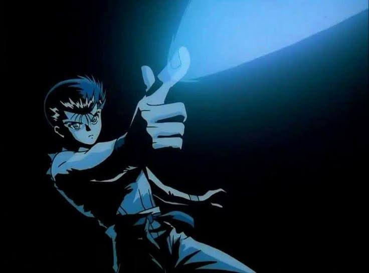 Screenshot from YuYu Hakusho that depicts Yusuke posing dramatically as he fires his spirit gun