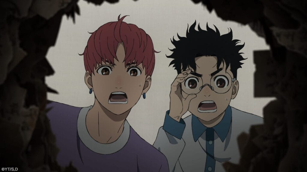 Still from Dan Da Dan season 2 that depicts Jiji, a red-haired teenager wearing earrings and a purple shirt, and Okarun, a bespectacled teenage boy with mussy hear, wearing a blue-and-white shirt, staring through a hole in shock.