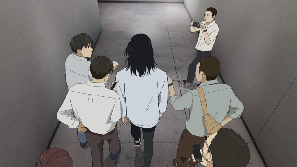 Still from 100 Meters that depicts a gaggle of reporters surrounding a long-haired man, who's walking down a drab grey hallway