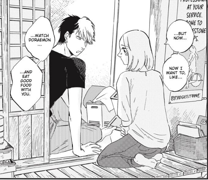Panel from Takahashi from the Bike Shop that depicts a blonde woman wearing a sweatshirt and jeans kneeling as she talks with a punkish man with two-toned hair.
Speech bubble: "... But now... Now I want to, like... watch Doraemon... and eat good food with you."